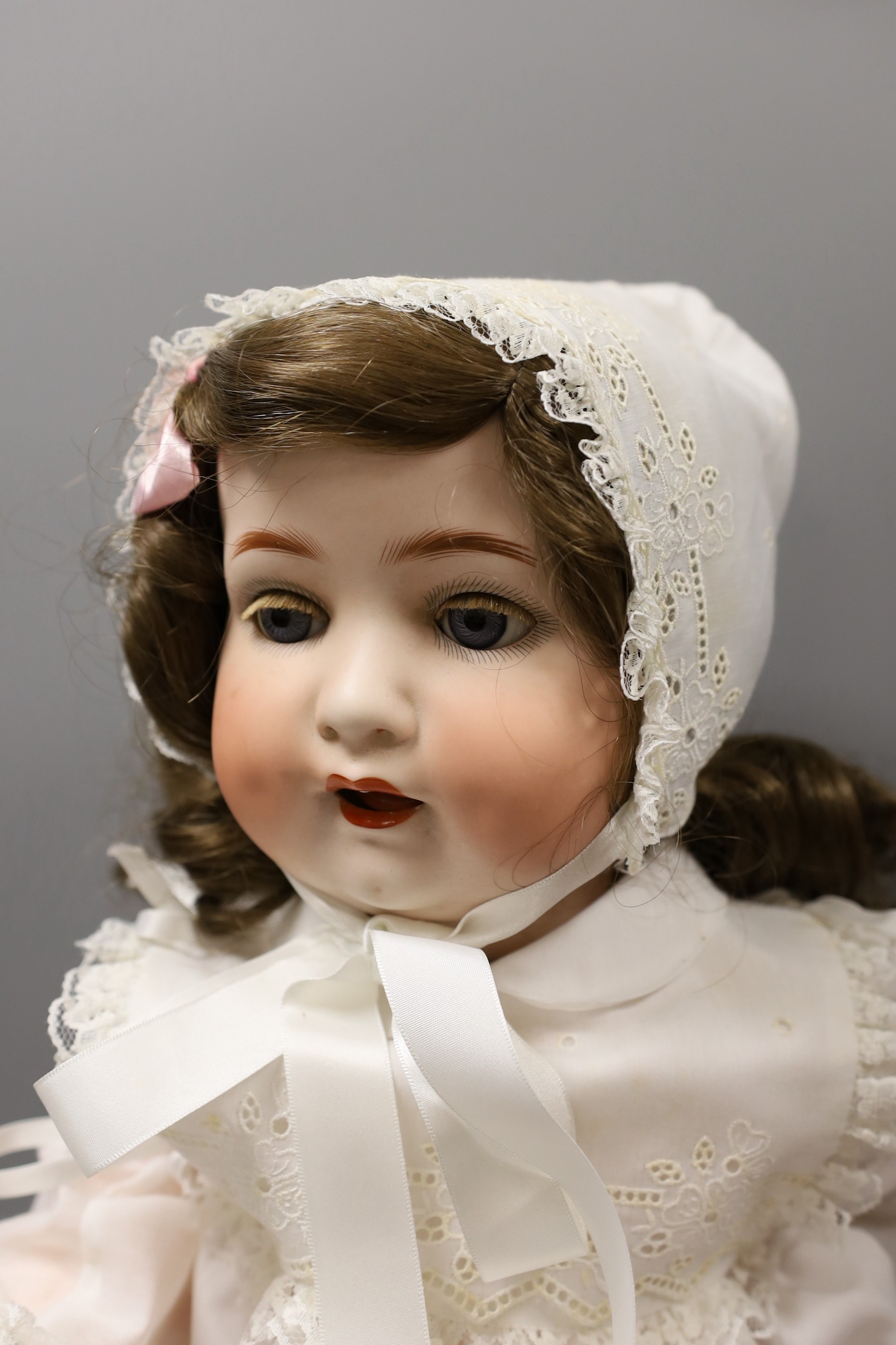 A Heubach Koppelsdorf bisque headed, open mouthed doll, 66cms long